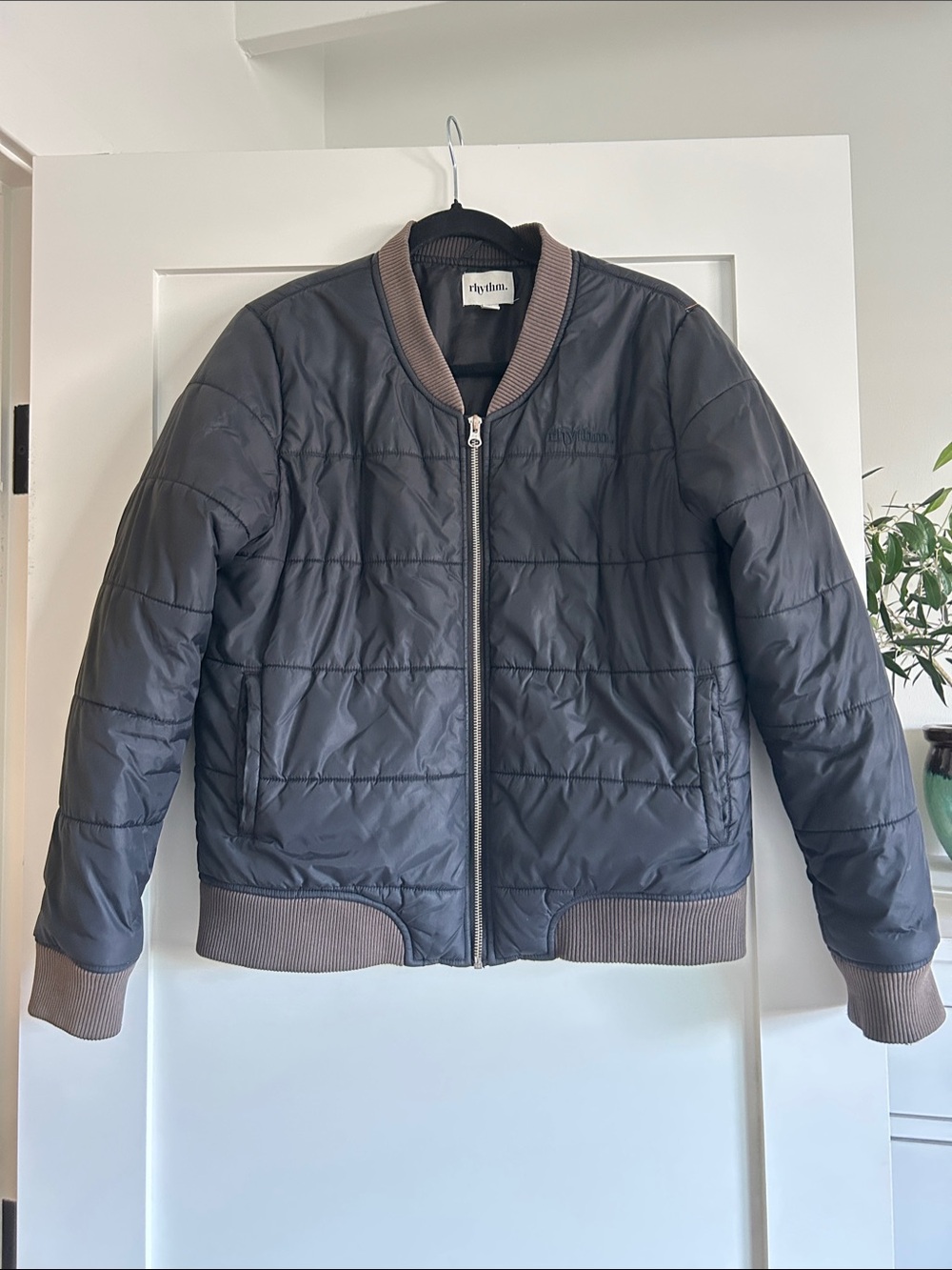 Rhythm Quilted Bomber Jacket in Black with Brown Trim
